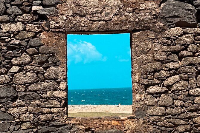 Aruba 6 Hours Private Island Tour - California Lighthouse to Tres Trapi: coast views and a water-shoes reality check
