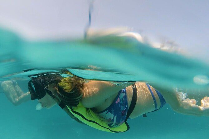 Private Boat Cruise with Snorkeling - Arashi Beach near the California Lighthouse: coral and calm-water timing