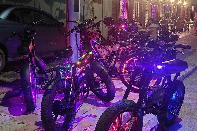 Semi-Private Christmas Edition Twilight Glow E-Bike Oranjestad - Plaza Turismo: the ARUBA sign, bars, and a quick local stop