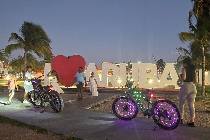 Semi-Private Christmas Edition Twilight Glow E-Bike Oranjestad - Riding through Oranjestad at night: architecture, landmarks, and plazas